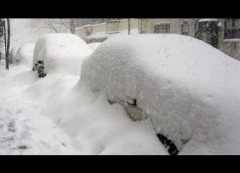 Ethiopian Dad Cleaning Snow Covered Cab